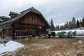 Farm with wooden house and horses in winter in Austria Royalty Free Stock Photo