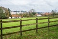 Farm wooden fence green field meadow pasture countryside village city houses