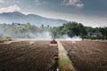 Farm Worker Drove Tractor for Tillage in Agriculture Fields. Farmer Working Soil Plowing Preparation on Tractor Machine for