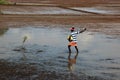 Farm worker throws fertilizer in the paddy fields Royalty Free Stock Photo