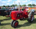 Farmall-C red antique farming tractor.