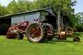 Farmall M tractor, front end loader, and lawn mower