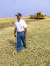 Farmer analyzing worl of combine harvester