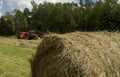 A farmer bales hay as he prepares for winter.