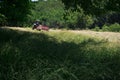 Farmer Bales Hay'