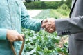 Farmer And Businessman Shaking Hands Royalty Free Stock Photo