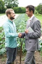 Farmer And Businessman Shaking Hands Royalty Free Stock Photo