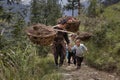 Farmer Carrying Bamboo Baskets on His Shoulders