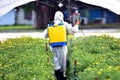 Farmer in Chemical protection suit sprayed Royalty Free Stock Photo