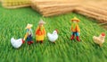 Farmer with chicken on meadow, miniature figure, agriculture concept,ai generated