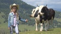 Farmer Child Pasturing Cows, Cowherd Girl with Cattle on Meadow in Mountains 4K