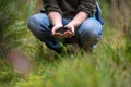 farmer collecting soil samples in a test tube in a field. Agronomist checking soil carbon and plant health on a farm. soil science Royalty Free Stock Photo