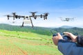 Farmer control agriculture drone fly to sprayed fertilizer plant