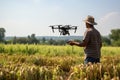 A farmer controls an agricultural drone in the field