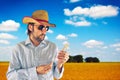 Farmer with cowboy straw hat in wheat field