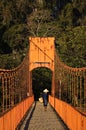 Farmer crossing bridge in Vang Vieng in Laos