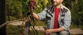 farmer cut grapevine. vinedresser cutting grapes bunch. male vineyard owner. Royalty Free Stock Photo