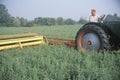 Farmer cutting hay field