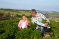 Farmer With Daughter Harvesting Organic Carrot Crop On Farm Royalty Free Stock Photo