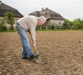 Farmer digging in the garden Royalty Free Stock Photo