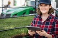 Farmer with digital tablet next to a pipe for drip irrigation. Royalty Free Stock Photo