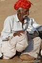 Farmer discussing his camels price at Pushkar fair