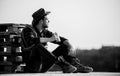 Farmer drink alcohol enjoy view from his farm. Watching sunset. Farmer cowboy handsome man relaxing after hard working Royalty Free Stock Photo