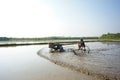 Farmer drives the tractor for plowing in the rice farm for preparation stage