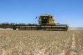 A combine harvester reaping a wheat crop in Australia.