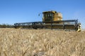 A combine harvester reaping a wheat crop in Australia.