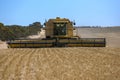 A combine harvester reaping a wheat crop in Australia.