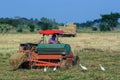 Farmer driving tractor in the fields. Royalty Free Stock Photo