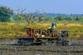 Farmer driving tractor in the fields. Royalty Free Stock Photo