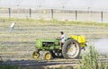Farmer spraying isecticed on a field