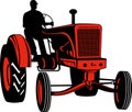 Farmer driving vintage tractor