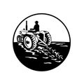 Farmer Driving a Vintage Tractor Viewed From Rear Circle Retro Black and White Royalty Free Stock Photo