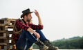 Farmer enjoy view from his farm. Peaceful mood. Watching sunset. Farmer cowboy handsome man relaxing after hard working Royalty Free Stock Photo