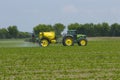 Farmer fertilizing field