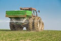 Farmer fertilizing wheat with nitrogen, phosphorus, potassium fertilizer Royalty Free Stock Photo