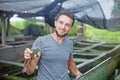 Farmer on frog farm in Bali Royalty Free Stock Photo