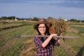 Farmer girl with basket and hayfork