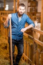 Farmer in the goat barn Royalty Free Stock Photo