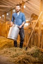 Farmer in the goat barn Royalty Free Stock Photo