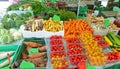 farmer harvested organic fruit box with tomatoes and carrots of various colors in europe market