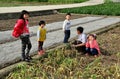 Pengzhou, China: Farmer with Children