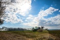 farmer and his tractor equip with a sprayer working in spring