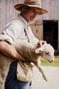 Farmer Holding Baby Lamb