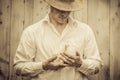 Farmer Holding a Baby Turkey