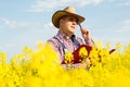A farmer inspects rapeseed Royalty Free Stock Photo