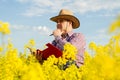 A farmer inspects rapeseed Royalty Free Stock Photo